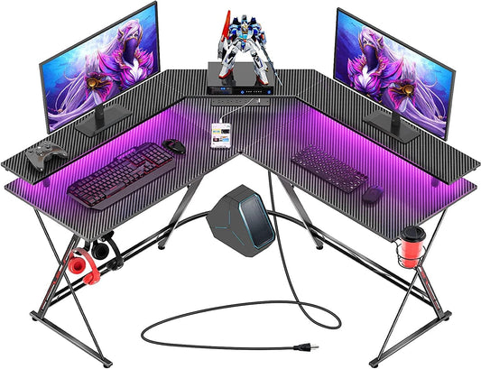 Chulovs Gaming Desk 50.4” with LED Strip & Power Outlets, L-Shaped Computer Corner Desk Carbon Fiber Surface with Monitor Stand, Ergonomic Gamer Table with Cup Holder, Headphone Hook (Black)