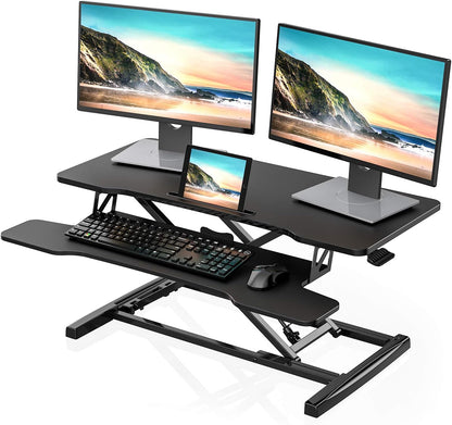 FITUEYES Height Adjustable Standing Desk 36â€ Wide Sit to Stand Converter Stand Up Desk Tabletop Workstation for Laptops Dual Monitor Riser Black SD309101WB