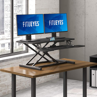 FITUEYES Height Adjustable Standing Desk 36â€ Wide Sit to Stand Converter Stand Up Desk Tabletop Workstation for Laptops Dual Monitor Riser Black SD309101WB